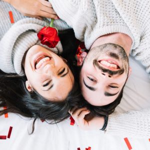 A happy couple with white woolen sweater