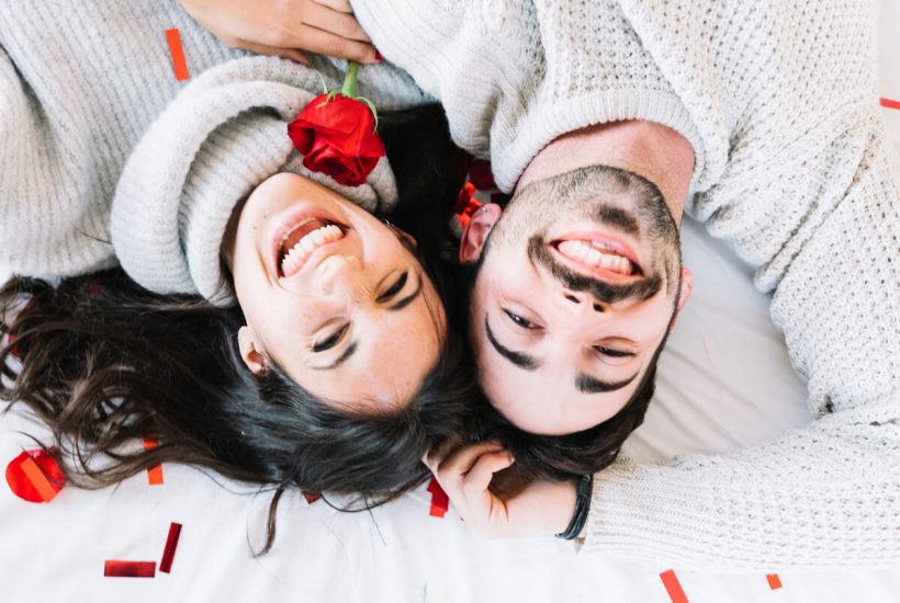 A happy couple with white woolen sweater