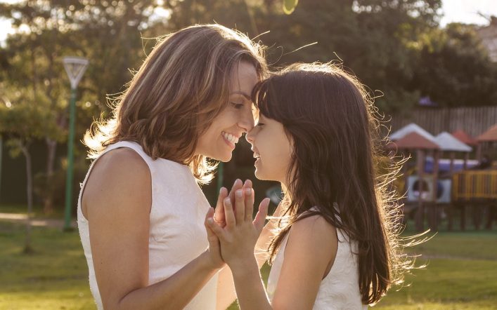 Mum and her daughter in sunny day